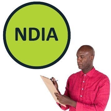 A bubble with NDIA printed in it. There is a man writing on a clipboard next to it.